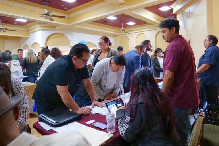 No Degree Required Hiring Event Photo of Job Seekers at Employer Tables