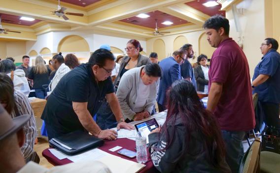 No Degree Required Hiring Event Photo of Job Seekers at Employer Tables