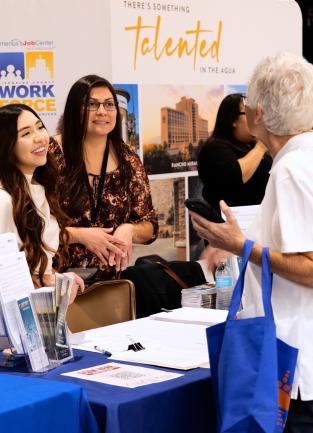 Riverside COunty Workforce Development Speaking to a Job Seeker at the  Valley‑Wide Employment Expo 